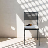 Conrad stabelbar stol sort